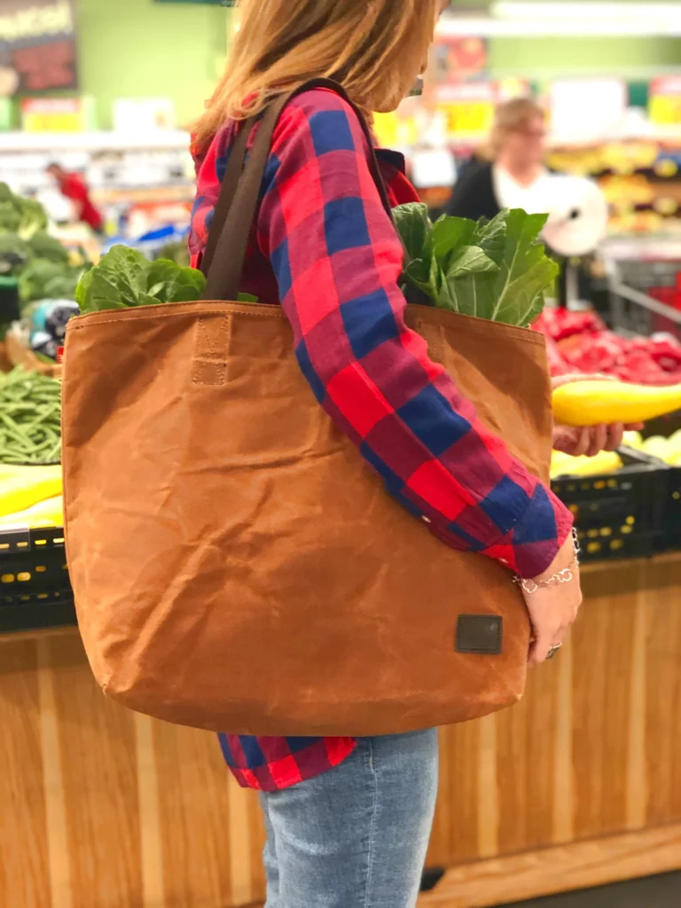 Woman carrying a bag of groceries